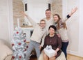 Happy family having fun near fireplace in Christmas Eve Royalty Free Stock Photo