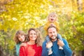 Happy family having fun outdoor in autumn park Royalty Free Stock Photo