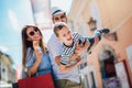 Family having fun outdoor after shopping