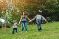 Happy family having fun outdoors.Young family enjoying life, together on nature. Happy family lifestyle. Family look. Concept of