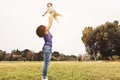 Happy family having fun in park outdoor - Mother and daughter enjoying good time playing together outside Royalty Free Stock Photo