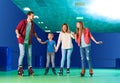 Family having fun at roller skating rink Royalty Free Stock Photo