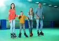 Family having fun at roller skating rink Royalty Free Stock Photo