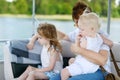Happy family having fun on a sailboat
