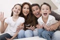 Happy Family Having Fun Sitting Laughing At Home Royalty Free Stock Photo