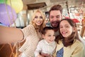 A happy family having a fun while taking a selfie at home together. Family, leisure, together Royalty Free Stock Photo