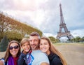 Happy family having fun together in Paris near the Eiffel tower Royalty Free Stock Photo