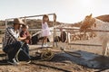 Happy family having fun together at ranch farm - Focus on left faces Royalty Free Stock Photo