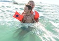 Happy family having fun on tropical white beach. Mother and a cute son. Positive human emotions, feelings, joy. Funny cute child m Royalty Free Stock Photo