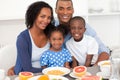 Happy family having healthy breakfast