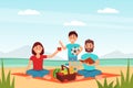 Happy family having picnic in city park. Mom, dad and son relaxing on nature. Parent and kid having good time outdoors Royalty Free Stock Photo