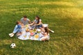 Happy family having picnic in park  sunny summer day Royalty Free Stock Photo