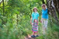 Happy family hiking in a pine wood