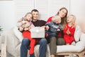 Happy family holding christmas gifts at home Royalty Free Stock Photo