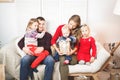 Happy family holding christmas gifts at home Royalty Free Stock Photo