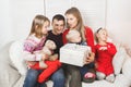 Happy family holding christmas gifts at home Royalty Free Stock Photo