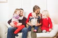 Happy family holding christmas gifts at home Royalty Free Stock Photo