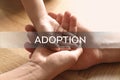 Happy family holding hands on background, closeup. Child adoption concept