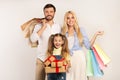 Happy Family Holding Shopping Bags And Gifts, White Background, Isolated Royalty Free Stock Photo