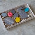 Happy family holiday, presents in box , gingerbread easter cookies in form of rabbits and eggs. Festive cookies in white box on