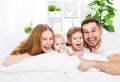 Happy family at home in the bed Royalty Free Stock Photo