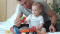 happy family at a home. dad and son play toy car and tractor. happy family at home together concept. son and father Royalty Free Stock Photo