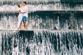 Happy family honeymoon holiday. Couple in cascade waterfall pool. Royalty Free Stock Photo