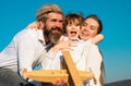 Happy family hug embrace outdoors. Cheerful family having fun outdoors. Child playing with mother and father and having Royalty Free Stock Photo