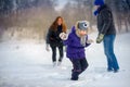 Happy family irat in snowballs