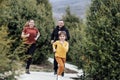 Happy family jogging in the summertime. Smiling young couple with their cute daughter doing sport Royalty Free Stock Photo