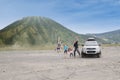 Happy family jump on volcanic desert