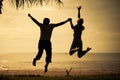 Happy family jumping on the beach Royalty Free Stock Photo