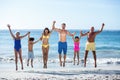 Happy family jumping on the beach Royalty Free Stock Photo