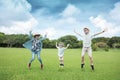 Happy  family jumping on the grass and enjoy summer vacation Royalty Free Stock Photo