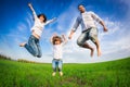 Happy family jumping Royalty Free Stock Photo