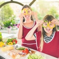 Happy family keeps fresh pieces of bell pepper