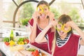 Happy family keeps fresh pieces of bell pepper