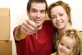 Happy family with the key of their new home Royalty Free Stock Photo