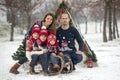 Happy family with kids, having fun outdoor in the snow on Christ Royalty Free Stock Photo