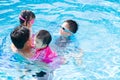 Happy family with kids having fun in swimming pool. Royalty Free Stock Photo