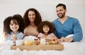 Happy family, kids and portrait of breakfast in bed, eating food and enjoy quality time together in home apartment Royalty Free Stock Photo