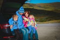 Happy family kids travel by car on road in nature Royalty Free Stock Photo