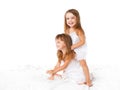 Happy family . kids twin sisters jumping on the bed, playing an Royalty Free Stock Photo