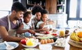 Happy family in the kitchen having fun and cooking together. Healthy food at home. Royalty Free Stock Photo