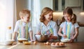 Happy family in kitchen. mother and children preparing dough, bake cookies Royalty Free Stock Photo