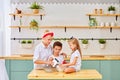 Happy family in the kitchen. mother and children preparing the dough, bake cookies Royalty Free Stock Photo