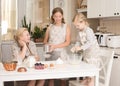 Happy Family in the Kitchen. Mother and Daughters Having Fun Baking  at Home. Domestic Food Concept Royalty Free Stock Photo