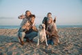 happy family with labrador dog showing peace symbols