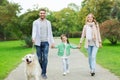 Happy family with labrador retriever dog in park Royalty Free Stock Photo