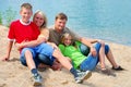 Happy family by the lake Royalty Free Stock Photo